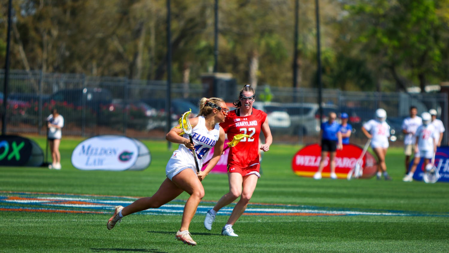 Florida midfielder Paisley Eagan runs with the ball in her crosse during the Gators' 14-13 loss to the No. 6 Maryland Terrapins Saturday, Feb. 25, 2023. 