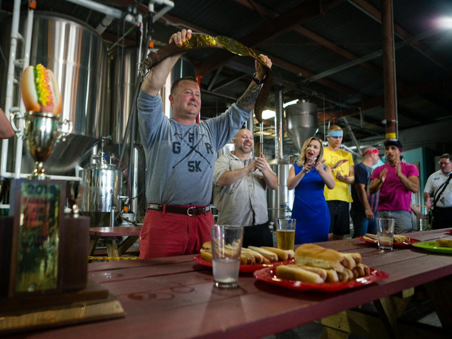 Lt. Sean Withers from Gainesville Fire Rescue won the grand champion belt for eating the most hot dogs (eight) by himself. Withers and other members of GFR were awarded first prize during the competition. Together, they consumed 25 hot dogs.