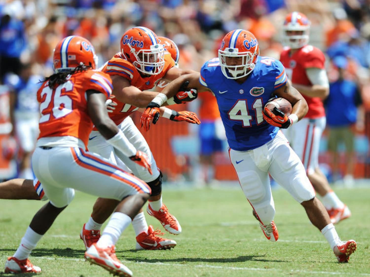 Hunter Joyer (41) runs the ball during Florida’s Orange and Blue Debut on Saturday in Ben Hill Griffin Stadium. The Gators’ two offenses combined for 606 yards in the game.