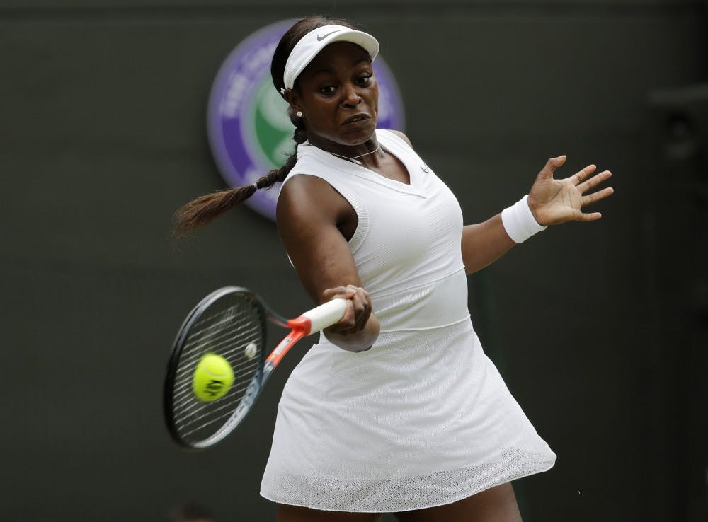 FILE - In this July 6, 2019, file photo, Sloane Stephens returns to Britain's Johanna Konta in a women's singles match at the Wimbledon Tennis Championships in London. Any World TeamTennis player or coach who tests positive for COVID-19 when arriving for the three-week 2020 season will be dropped from the league without pay. The health plan released Tuesday, June 16, 2020, by the WTT for its matches starting July 12 at The Greenbrier in West Virginia also calls for two daily temperature checks for spectators, no ball kids, a chair umpire aided by electronic line-calling instead of line judges, and no high-fives or handshakes between opponents. The rosters announced for the WTT's nine teams include Grand Slam title winners Kim Clijsters, Sloane Stephens, Sofia Kenin and the Bryan brothers. (AP Photo/Ben Curtis, File)