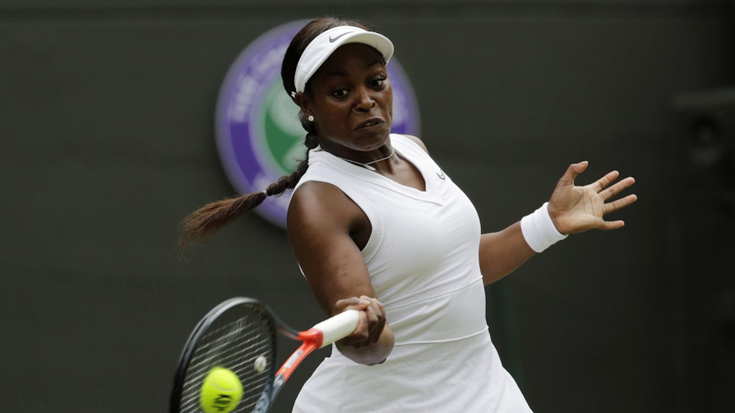 FILE - In this July 6, 2019, file photo, Sloane Stephens returns to Britain's Johanna Konta in a women's singles match at the Wimbledon Tennis Championships in London. Any World TeamTennis player or coach who tests positive for COVID-19 when arriving for the three-week 2020 season will be dropped from the league without pay. The health plan released Tuesday, June 16, 2020, by the WTT for its matches starting July 12 at The Greenbrier in West Virginia also calls for two daily temperature checks for spectators, no ball kids, a chair umpire aided by electronic line-calling instead of line judges, and no high-fives or handshakes between opponents. The rosters announced for the WTT's nine teams include Grand Slam title winners Kim Clijsters, Sloane Stephens, Sofia Kenin and the Bryan brothers. (AP Photo/Ben Curtis, File)