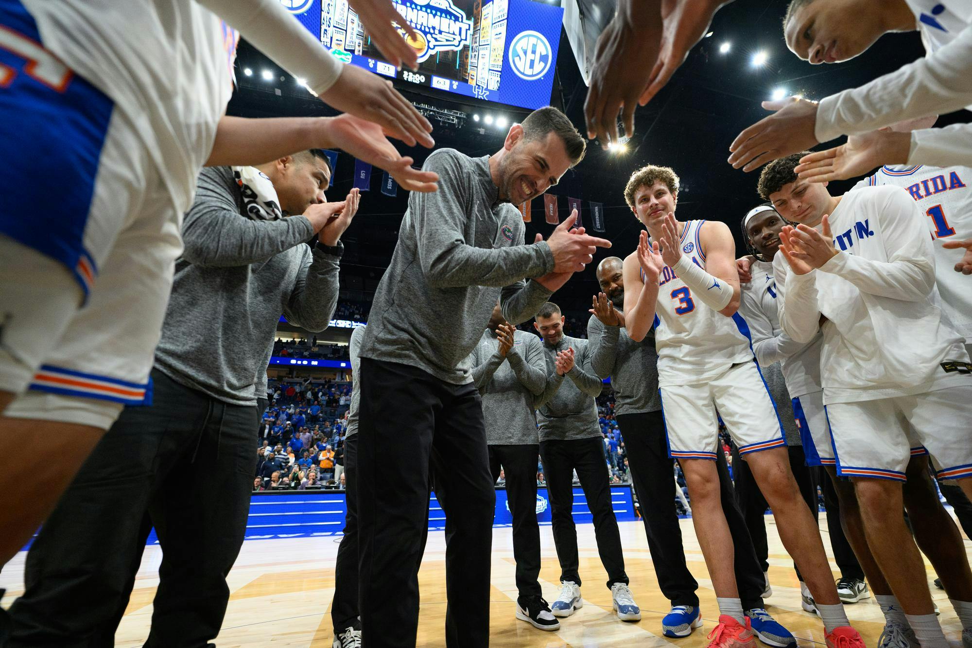 Florida head coach Todd Golden claps out his team after winning an SEC Men's Basketball Tournament quarterfinal game against Kentucky, Friday, March 13, 2026, in Nashville, Tenn.