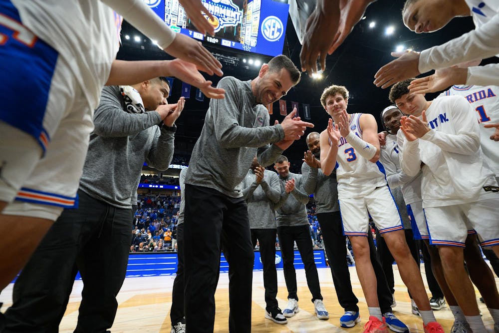 Florida head coach Todd Golden claps out his team after winning an SEC Men's Basketball Tournament quarterfinal game against Kentucky, Friday, March 13, 2026, in Nashville, Tenn.