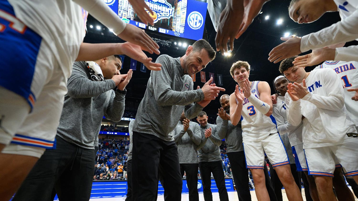 Florida head coach Todd Golden claps out his team after winning an SEC Men's Basketball Tournament quarterfinal game against Kentucky, Friday, March 13, 2026, in Nashville, Tenn.