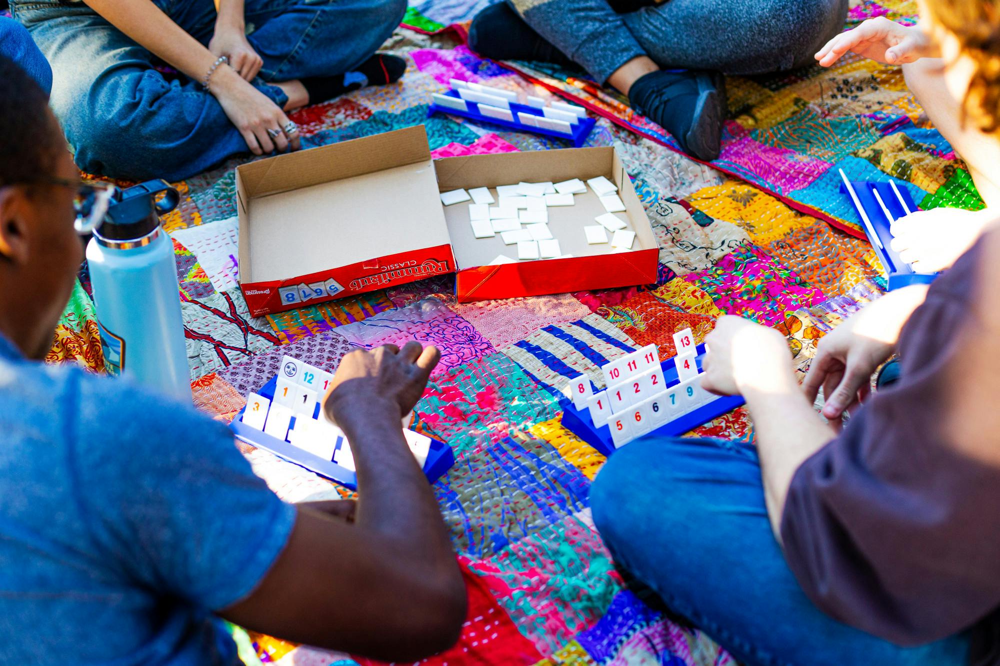 UF Students play card games together at Plaza of the Americas on Thursday, Feb. 20, 2025.