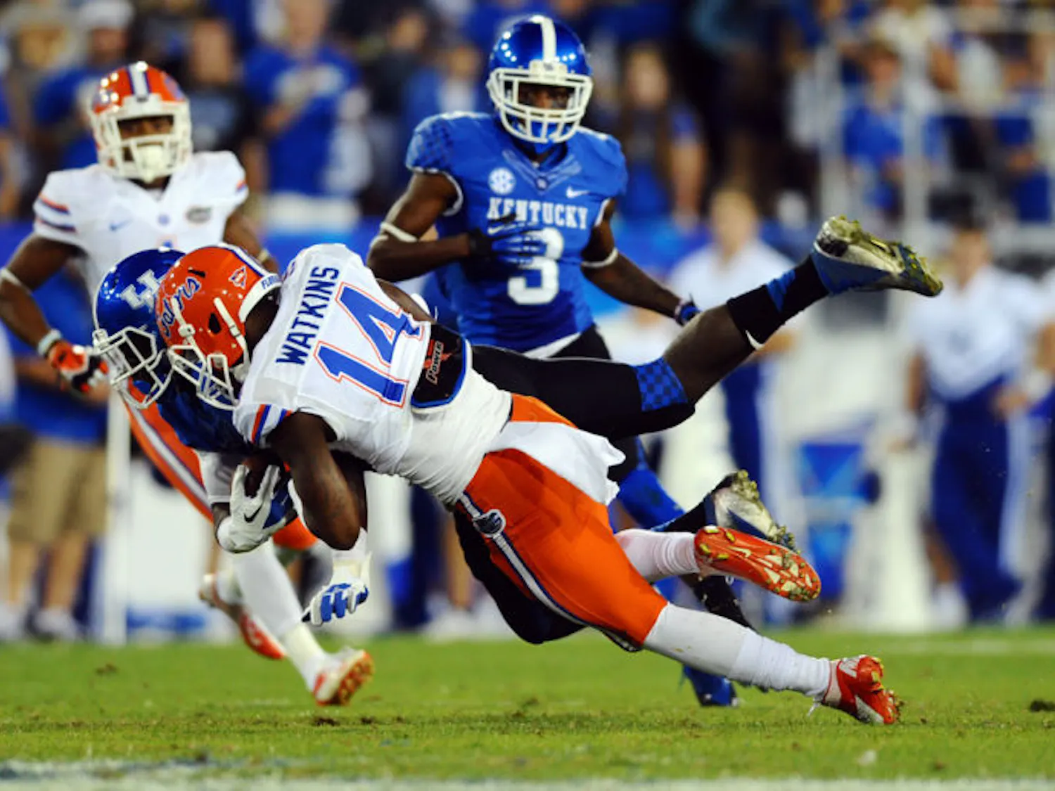 Jaylen Watkins (14) tackles Kentucky wide receiver Alexander Montgomery during the Gators’ 24-7 victory against the Wildcats on Saturday at Commonwealth Stadium.