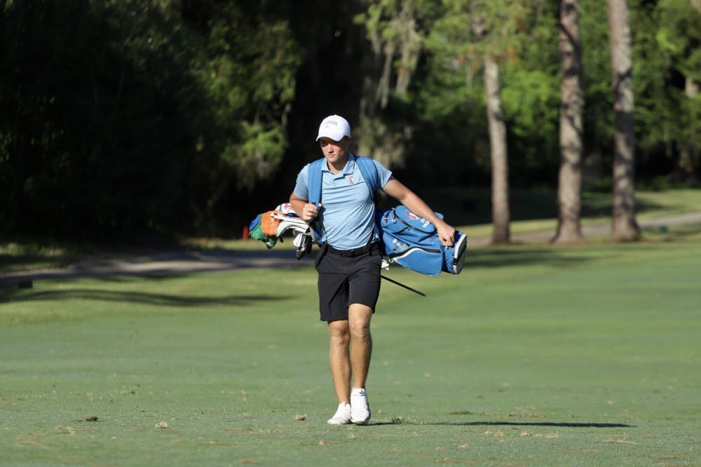 Florida's Joe Pagdin walks the fairways of Mark Bostick Golf Course in Gainesville, Florida. Pagdin shot 79 Saturday as the Gators slipped down to a tie for 22nd in the national championship.