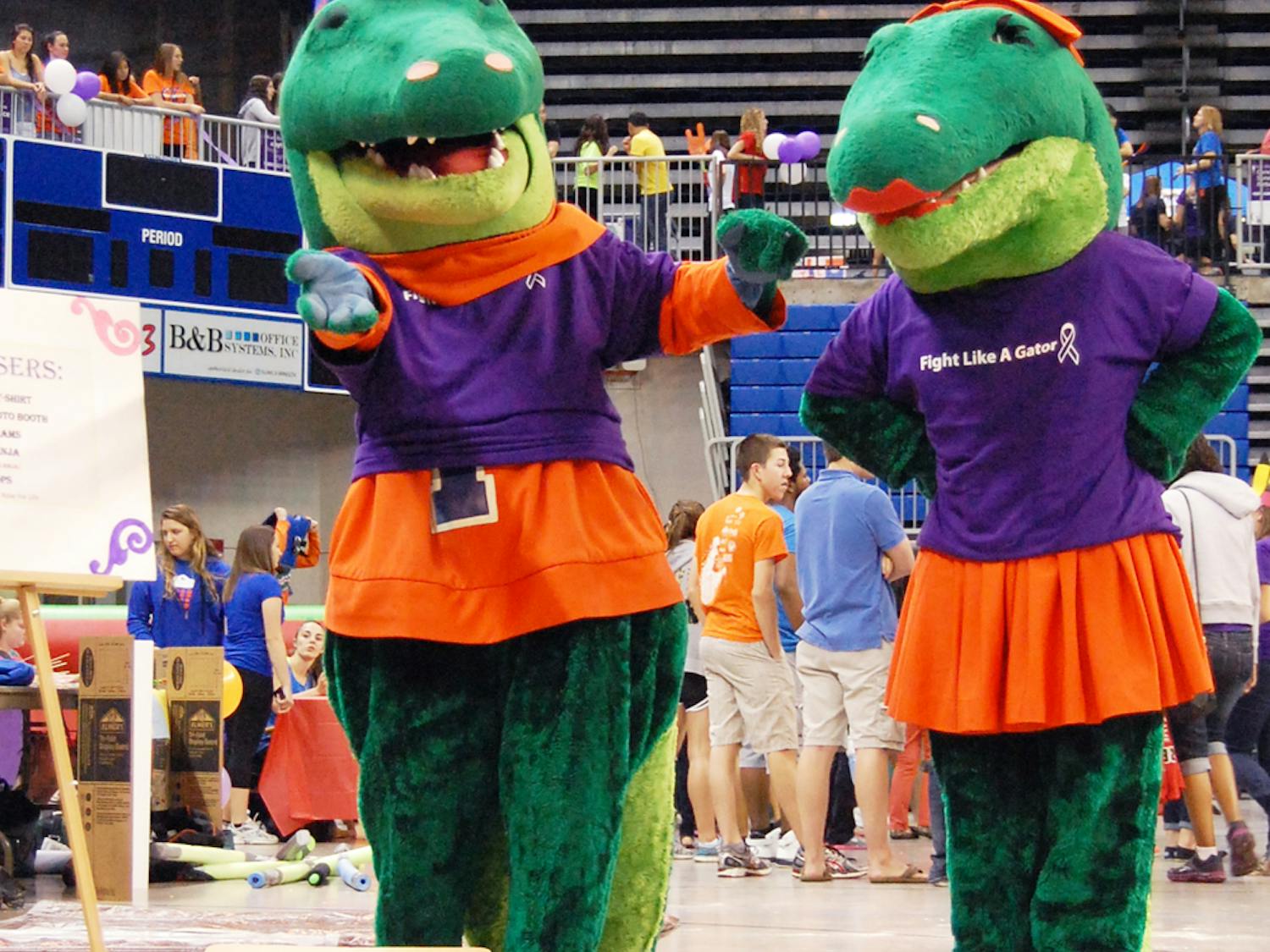 Albert and Alberta play a game of cornhole at UF's Relay for Life in the Stephen C. O'Connell Center on Friday evening. The event raised about $130,000.