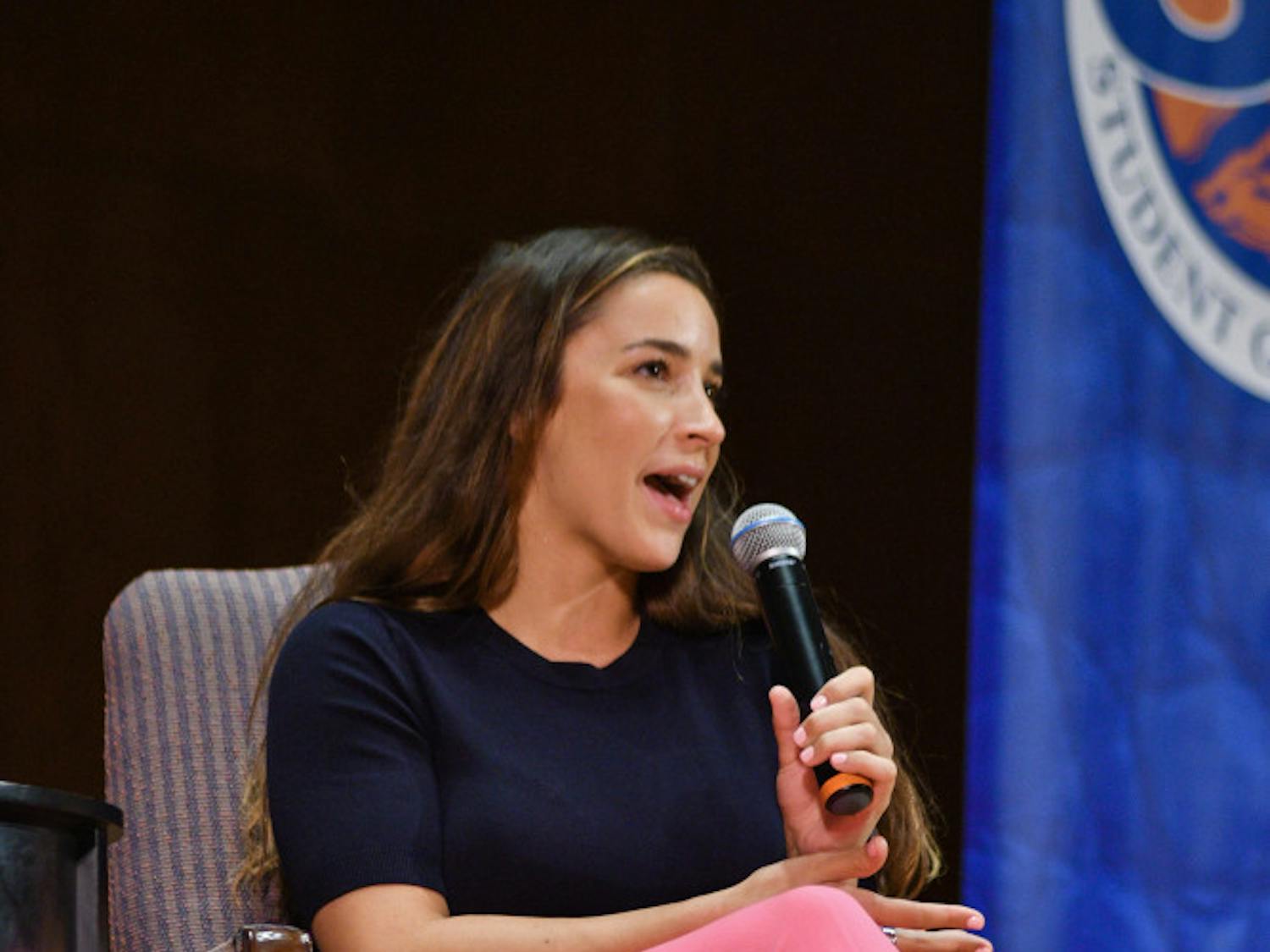 Aly Raisman, team captain of the gold medal-winning USA gymnastics team in 2012 and 2016, speaks Tuesday night at the University Auditorium. Raisman talked about her dream of becoming an Olympian and her training as well as the letter she wrote and read to her abuser Larry Nassar.  