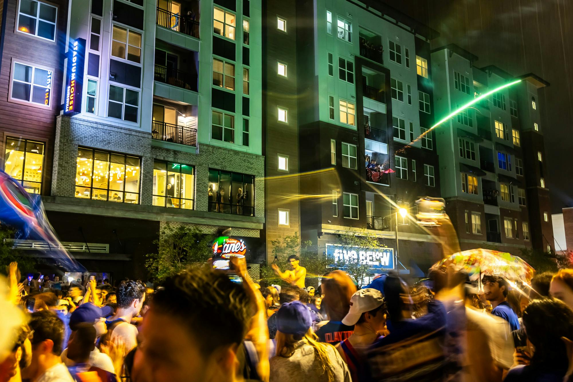 Fireworks light up the night sky above as Florida fans celebrate at Midtown following the Gator's NCAA Championship victory on Monday, April 7, 2025.