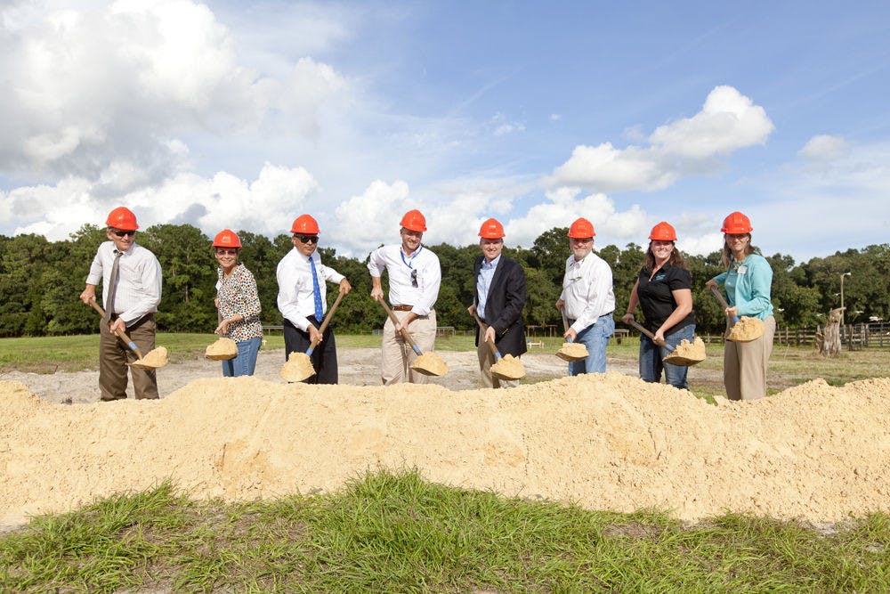 A group of Florida cattlemen and executives break ground for the construction of the UF/IFAS Beef Teaching Unit, 3301 23rd Terrace, on Sept. 10, 2015. The 80-acre farm will house a new cattle processing facility and student housing that will be used by animal science students for research.