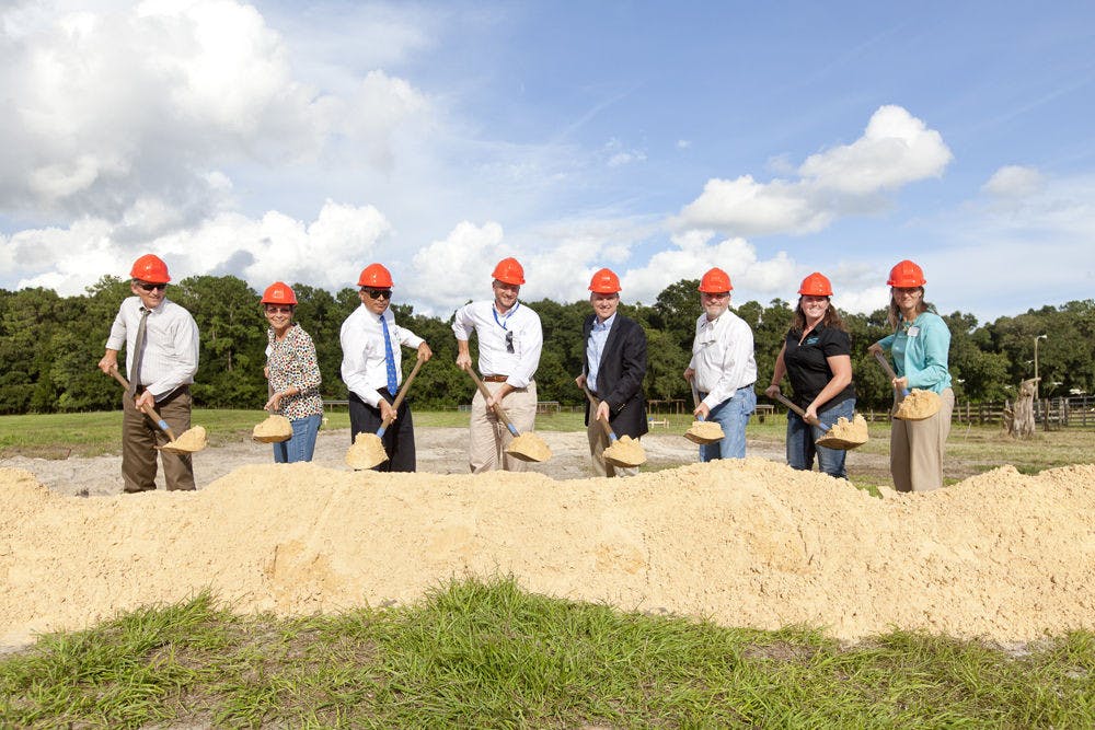 <p>A group of Florida cattlemen and executives break ground for the construction of the UF/IFAS Beef Teaching Unit, 3301 23rd Terrace, on Sept. 10, 2015. The 80-acre farm will house a new cattle processing facility and student housing that will be used by animal science students for research.</p>