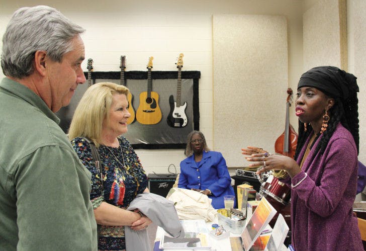 Queen Quet, head-of-state for the Gullah/Geechee nation, speaks with Headmaster of Oak Hall School Richard Gehman and his wife, Vicki, during her visit to Gainesville on Friday. Her visit was part of the Gullah/Geechee Land &amp; Legacy World Tour to promote the group’s contributions to society.