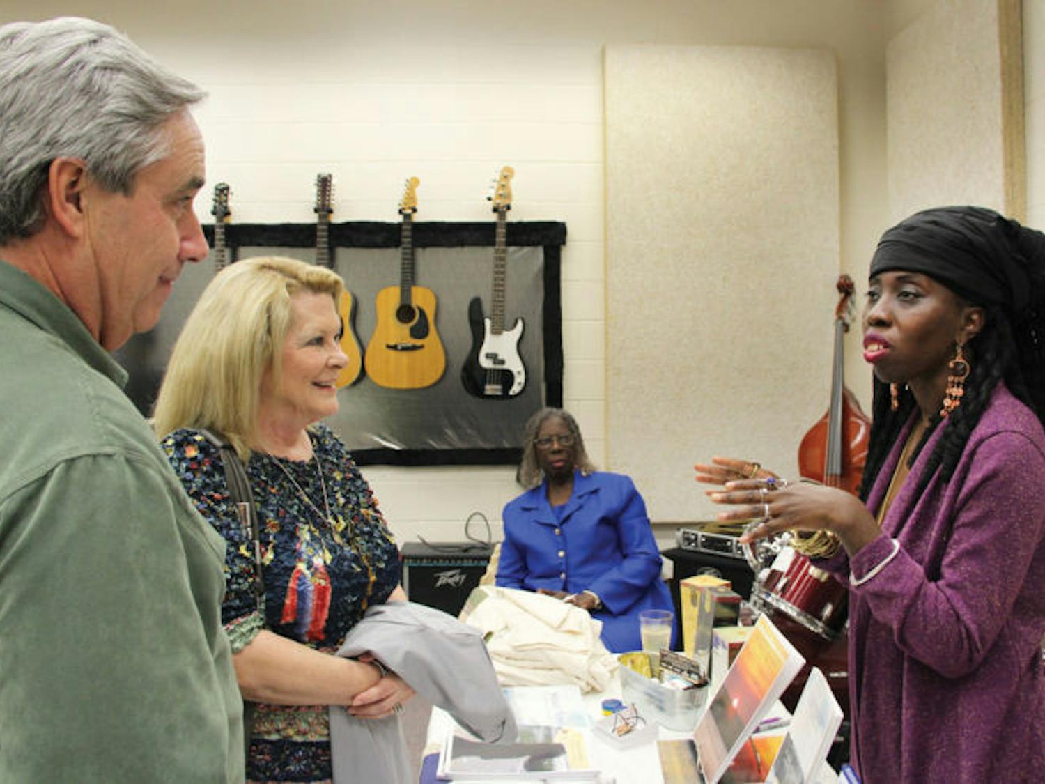 Queen Quet, head-of-state for the Gullah/Geechee nation, speaks with Headmaster of Oak Hall School Richard Gehman and his wife, Vicki, during her visit to Gainesville on Friday. Her visit was part of the Gullah/Geechee Land &amp; Legacy World Tour to promote the group’s contributions to society.
