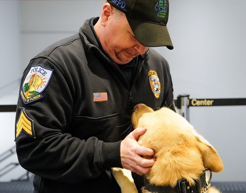 <p>Sgt. Kenny Motes with Beto, his yellow labrador retriever, on Friday, Jan. 24, 2025. </p>