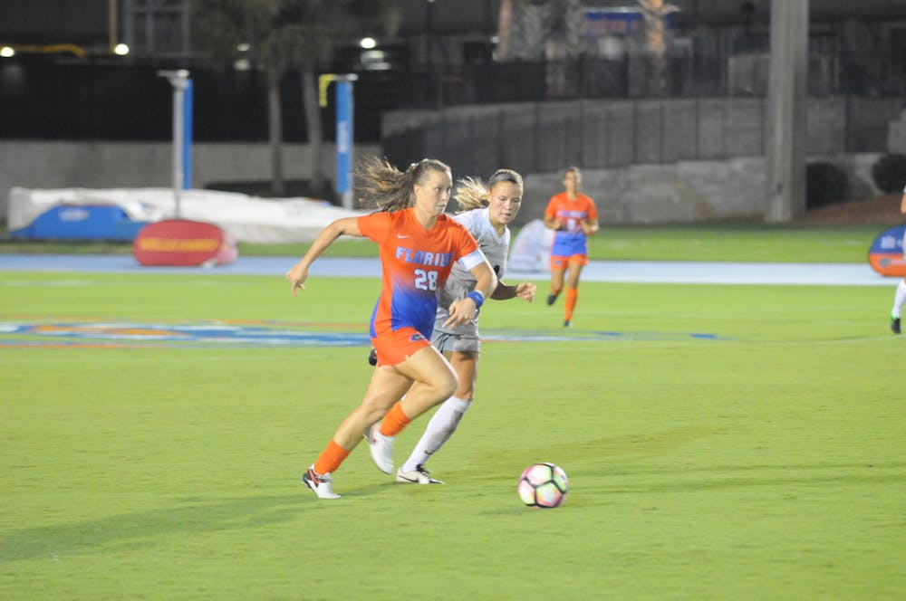 <p>Meggie Dougherty Howard dribbles the ball during Florida's 3-2 win over UCF on Sept. 18.</p>