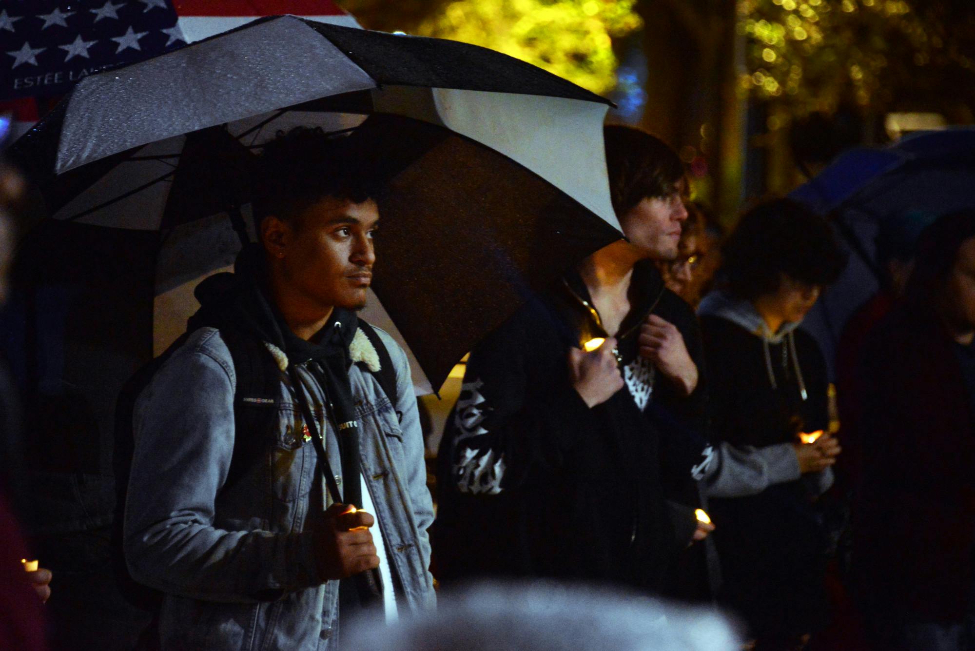 Oscar Santiago Perez holds a candle during a Transgender Day of Remembrance ceremony on the steps of Gainesville City Hall to honor those lost from violence toward the transgender community Sunday, Nov. 20, 2022.   