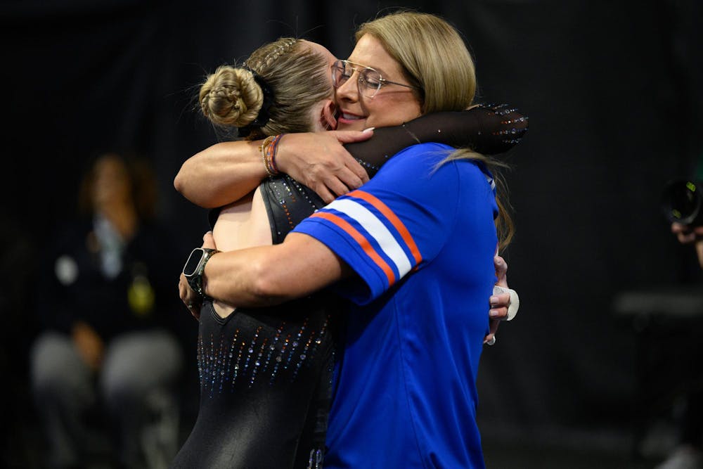<p>Florida head coach Jenny Rowland hugs gymnast Riley McCusker after her bars routine during the NCAA gymnastics National Championship against Oklahoma, LSU and Minnesota, Saturday, April 18, 2026, in Fort Worth, Texas.</p>