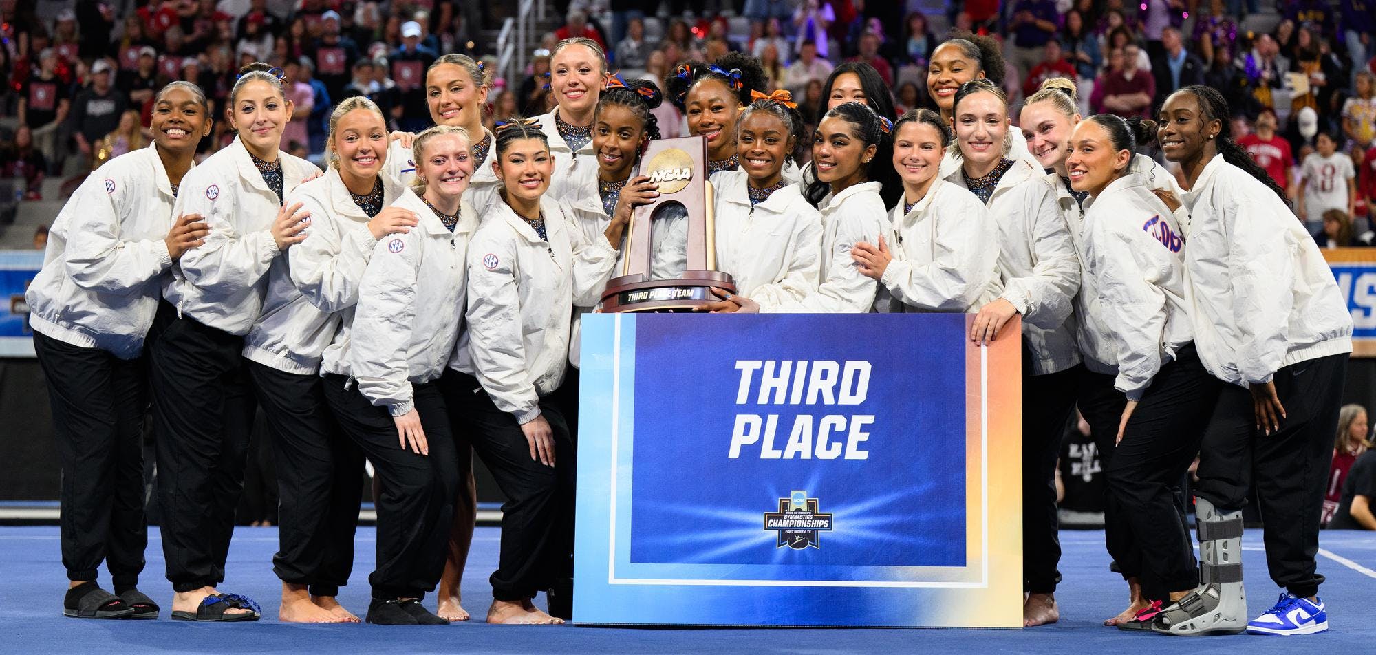 The Gators pose and hold their third place trophy after the NCAA gymnastics National Championship against Oklahoma, LSU and Minnesota, Saturday, April 18, 2026, in Fort Worth, Texas.