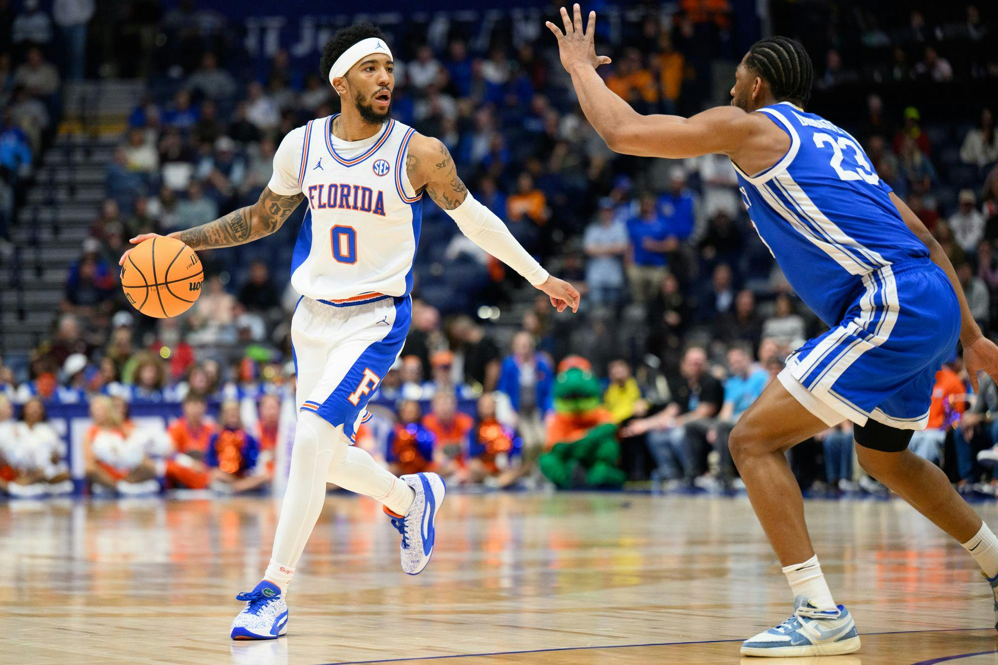 Florida guard Boogie Fland (0) dribbles during the first half of an SEC Men's Basketball Tournament quarterfinal game against Kentucky, Friday, March 13, 2026, in Nashville, Tenn.