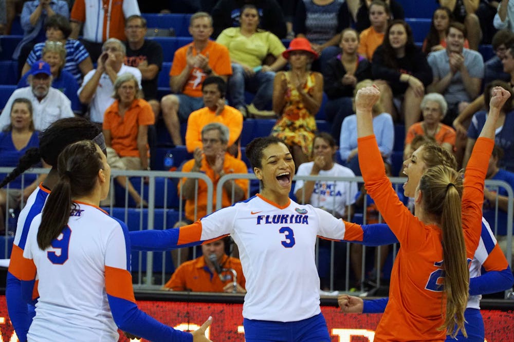 <p>UF right-side hitter Alex Holston (3) celebrates during Florida's 3-0 win against St. John's on Sept. 17, 2015, in the O'Connell Center.</p>