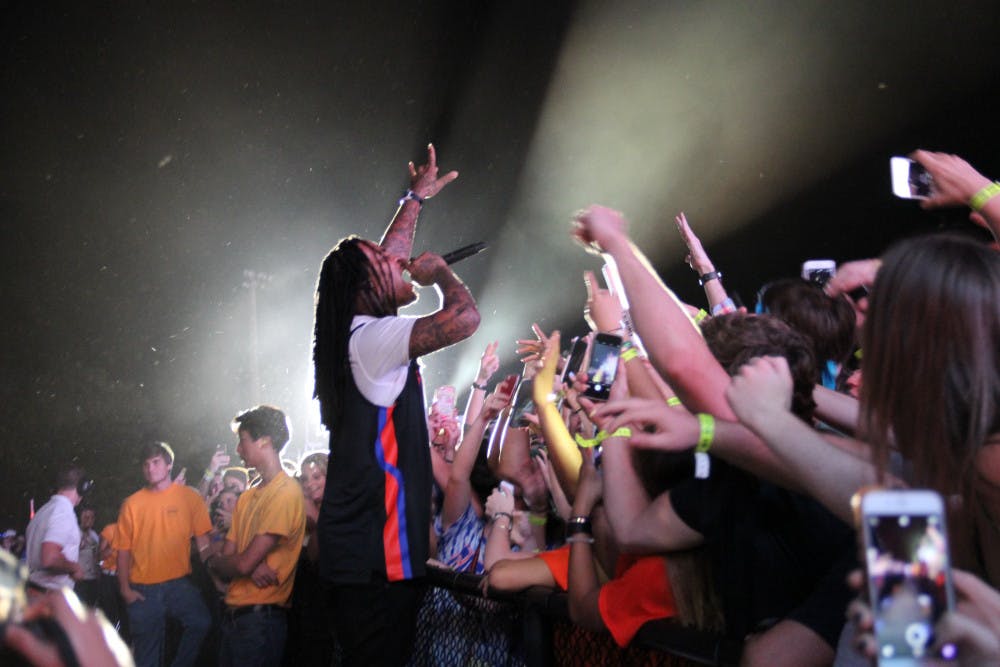 <p>Waka Flocka sings to the crowd during Gator Growl at Flavet Field on Friday evening. </p>