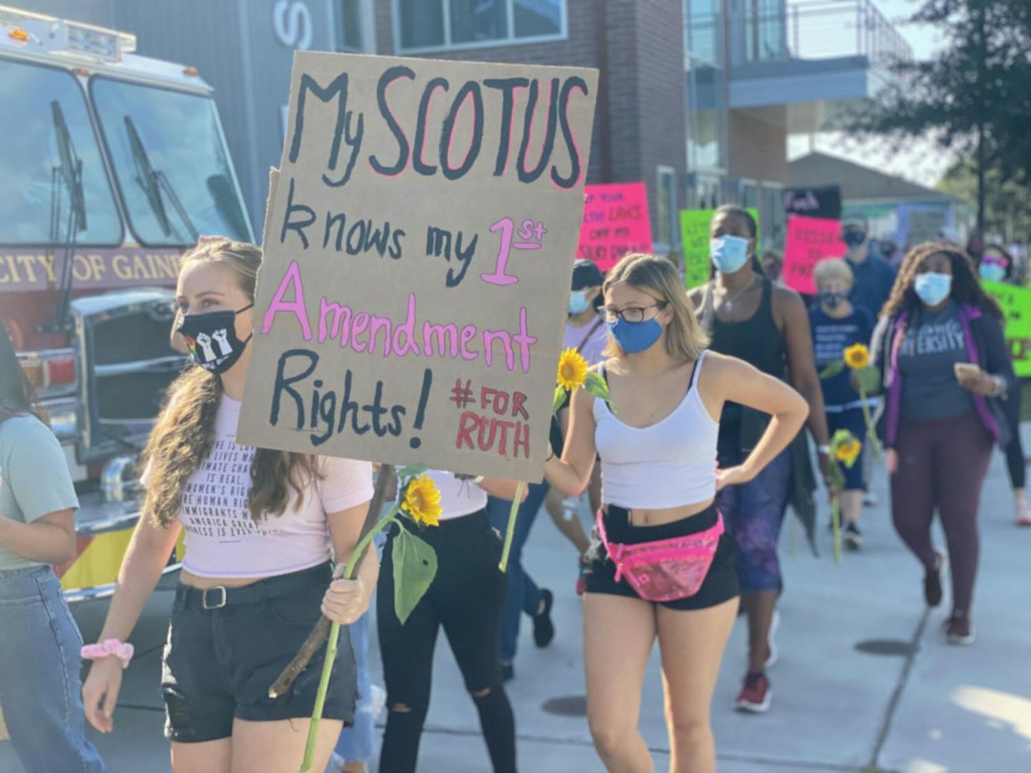 Amanda Foreman, a 19-year-old UF animal sciences sophomore, marches alongside Alachua County protesters down Main St. to Bo Diddley Plaza.