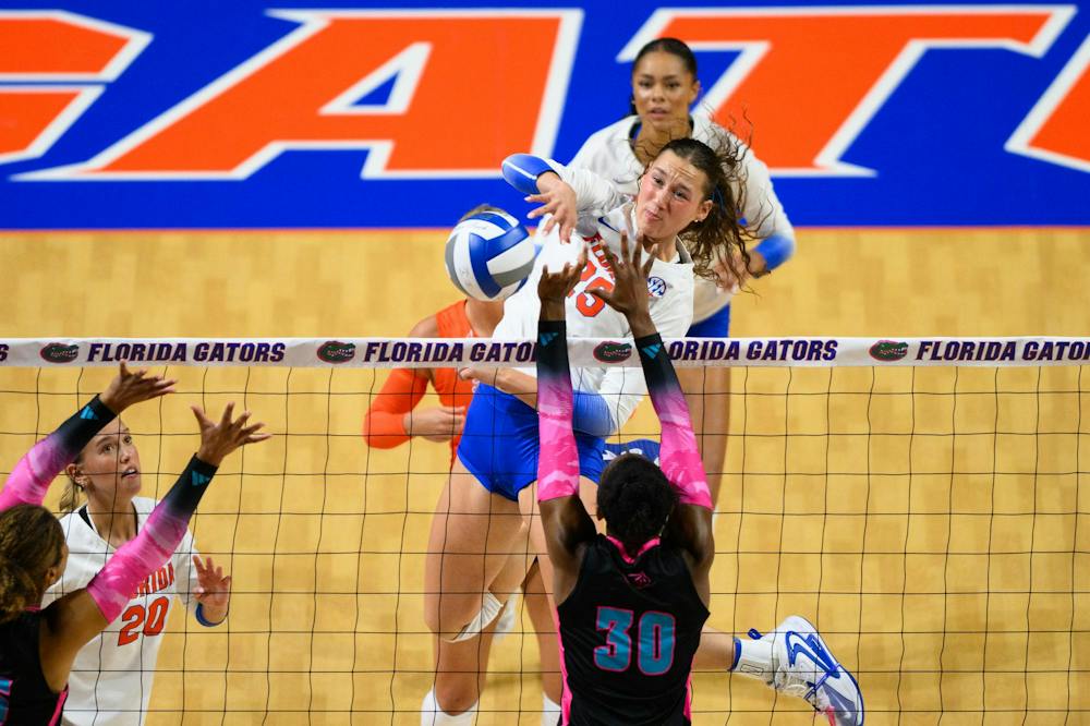 Florida middle blocker Alec Rothe (25) hits during an NCAA Volleyball match against FAU, Friday, Sept. 11, 2026, in Gainesville, Fla.