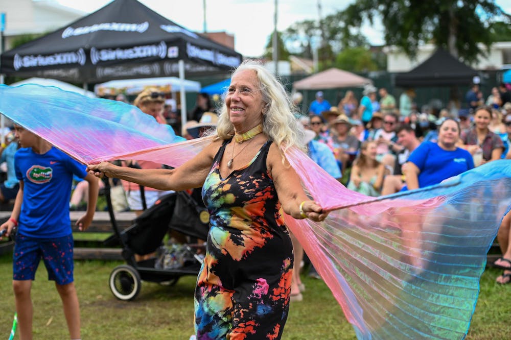 <p>Dancing to a tribute cover of “Love and Luck” by Jimmy Buffett, Lake City resident Lori Cramer has been using her wings to celebrate life for five years. Cramer traveled to Gainesville for the Jimmy Buffett Festival at Heartwood Soundstage on Sunday, Aug. 31, 2025.</p>