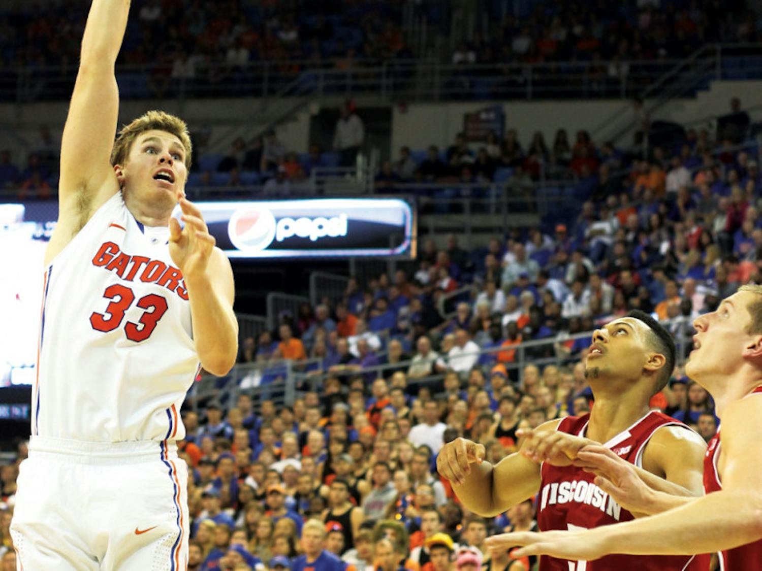 Forward Erik Murphy (33) attempts a shot in UF’s 74-56 win against Wisconsin on Wednesday in the O’Connell Center. Murphy tied a career high with 24 points.