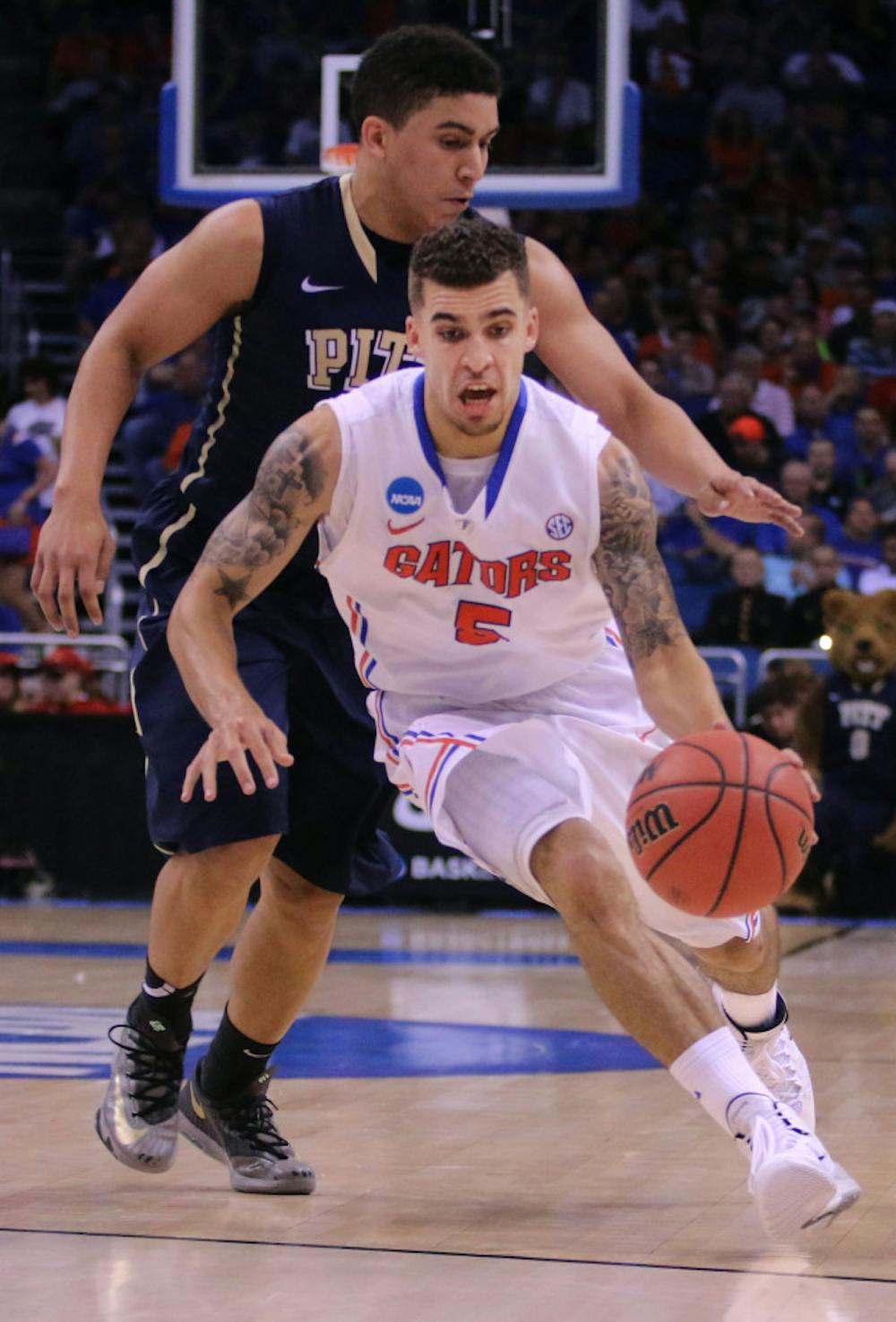 <p>Scottie Wilbekin drives the lane Saturday in Florida's 61-45 victory over Pitt.</p>