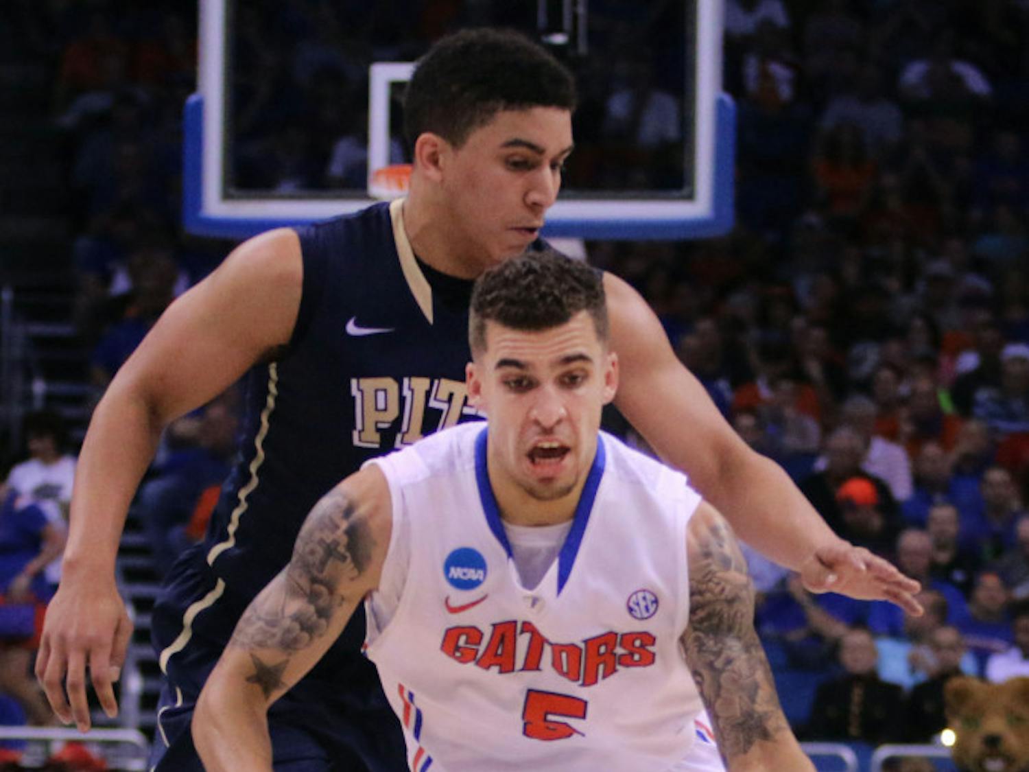 Scottie Wilbekin drives the lane Saturday in Florida's 61-45 victory over Pitt.
