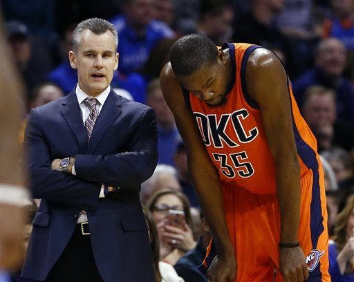 Oklahoma City Thunder head coach Billy Donovan, left, talks with Oklahoma City Thunder forward Kevin Durant, right, in the fourth quarter of an NBA basketball game in Oklahoma City, Sunday, Dec. 27, 2015. Oklahoma City won 122-112. (AP Photo/Alonzo Adams)