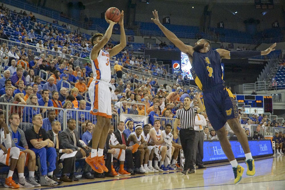 <p>Devin Robinson shoots a three during Florida's 105-54 win against North Carolina A&amp;T on Nov. 16, 2015, in the O'Connell Center.</p>