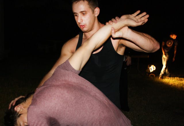Political science senior Matthew Sarrell, 23, escapes a choke hold during a Krav Maga class at UF Hillel on Tuesday evening. Krav Maga is the official self-defense system of the Israeli Defense Forces.