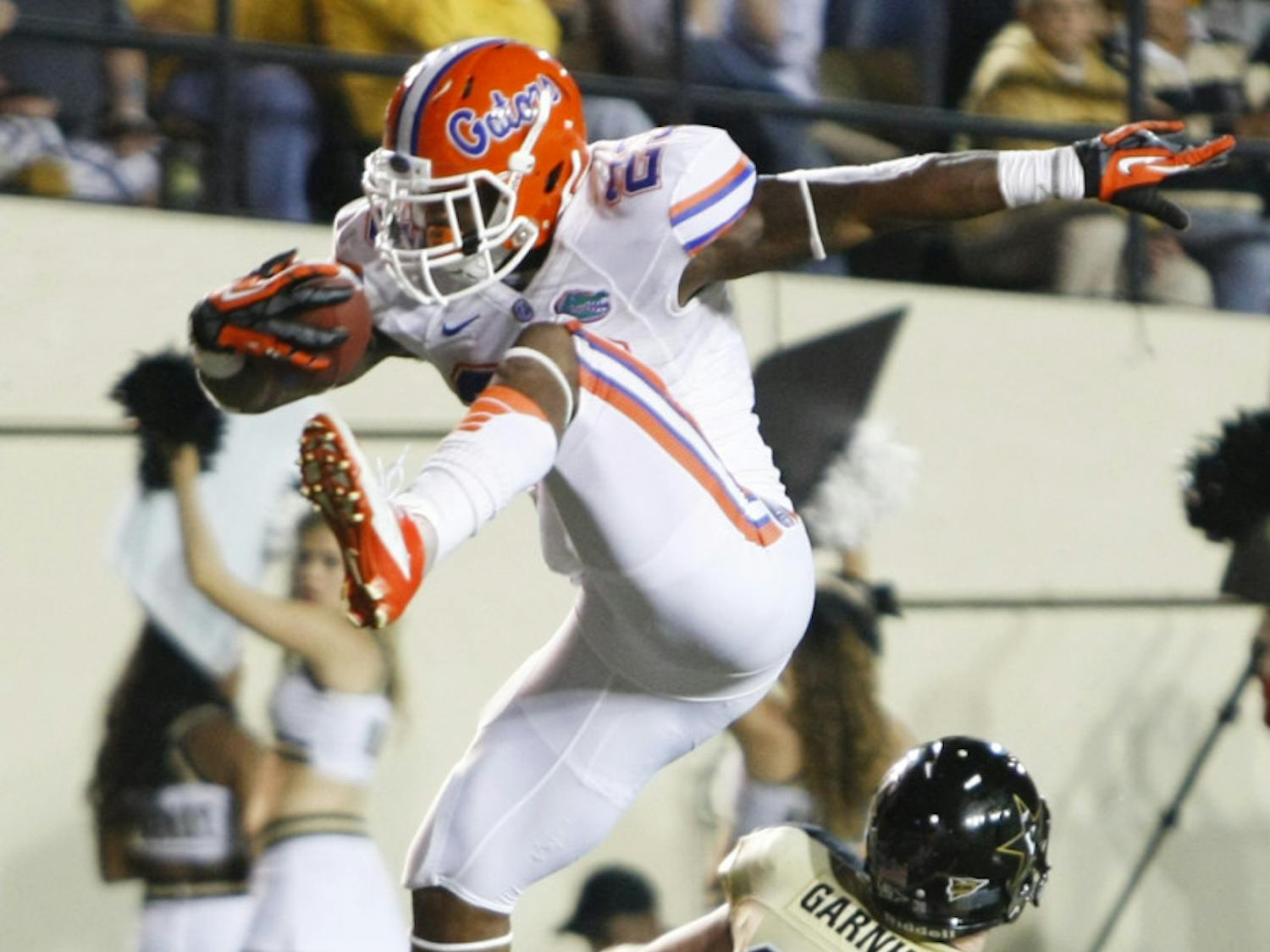 Senior running back Mike Gillislee attempts to hurdle over a Vanderbilt defender during Florida's 31-17 win against Vanderbilt in Nashville, Tenn. Gillislee leads Southeastern Conference running backs in rushing yardage. South Carolina running back Marcus Lattimore tops the conference in rushing attempts with 129.