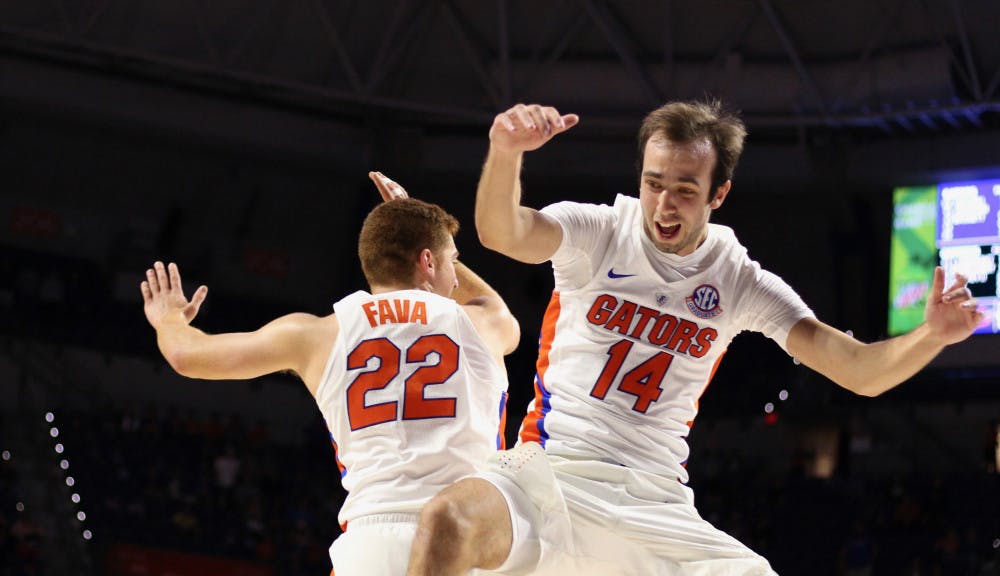 <p>Florida walk-on guards Mak Krause and Andrew Fava celebrate during UF's 108-68 win over North Florida on Nov. 16.</p>