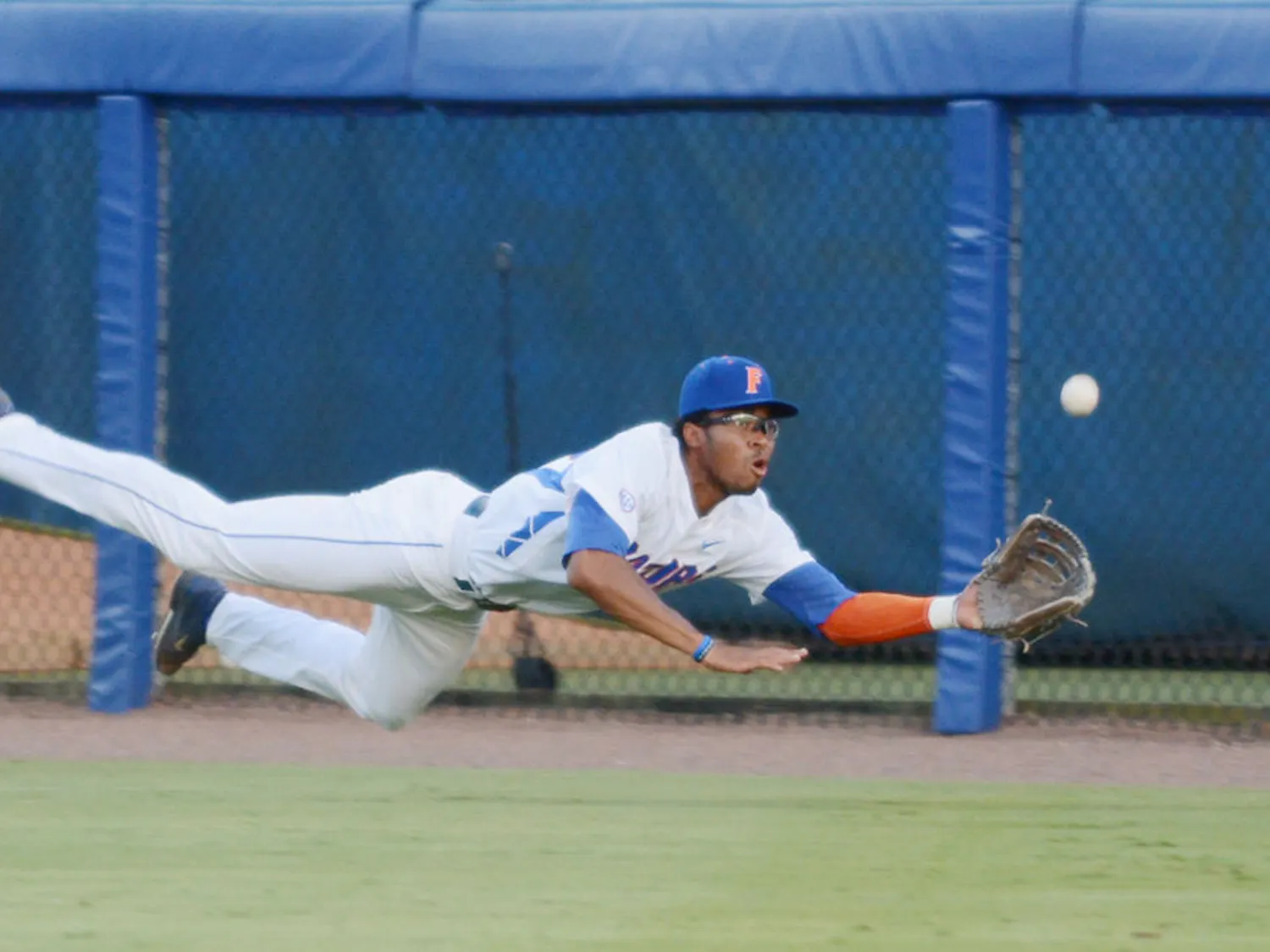 UF outfielder Buddy Reed dives for a catch during Florida's win against Florida A&M in the 2015 NCAA Regionals at McKethan Stadium.