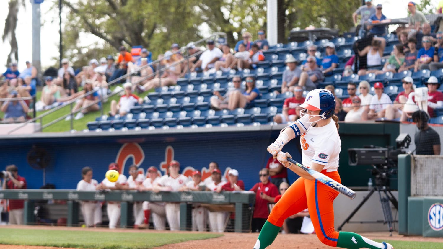 Gators softball sophomore catcher Jocelyn Erickson in her swinging motion during the team's 10-0 win over the Indiana Hoosiers on Sunday, March 17, 2024. 