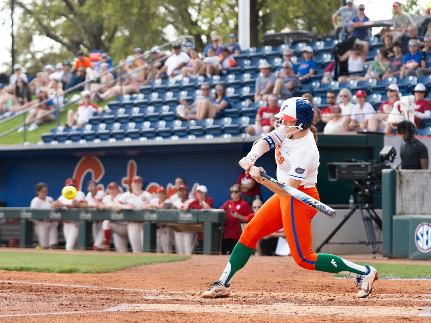 Gators softball sophomore catcher Jocelyn Erickson in her swinging motion during the team's 10-0 win over the Indiana Hoosiers on Sunday, March 17, 2024. 