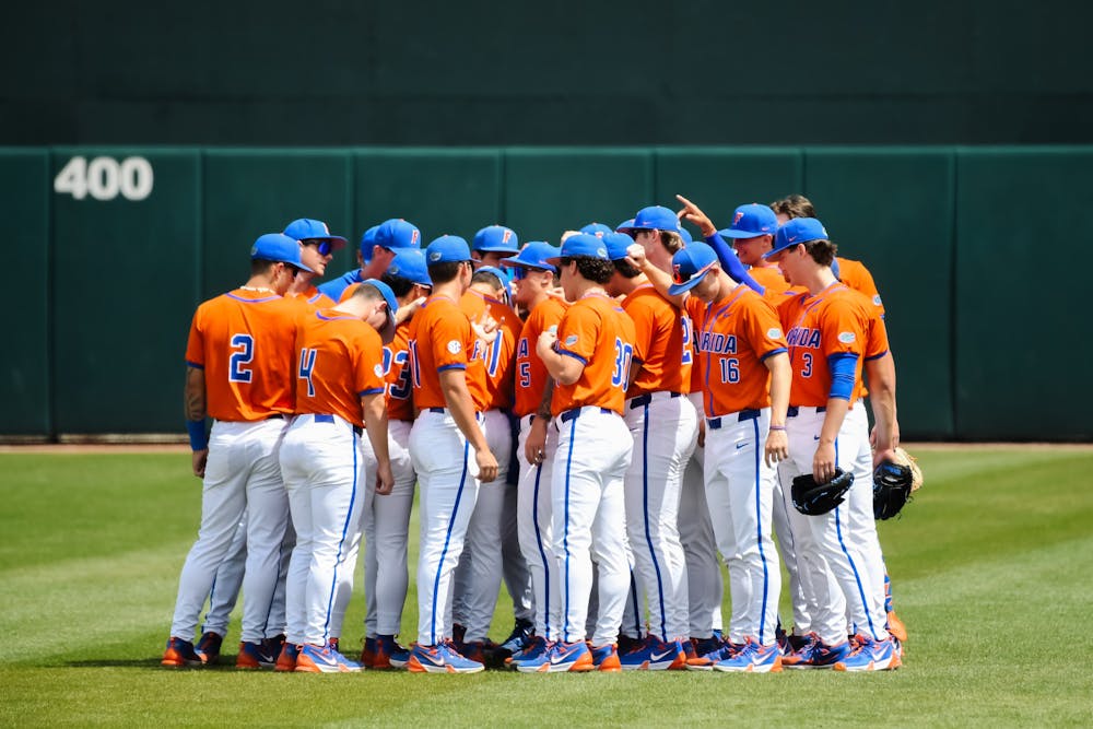 <p>Gators sophomore baseball player Ashton Wilson, 30, huddles with the team during the UF vs. Mississippi State on March 31, 2024.</p>