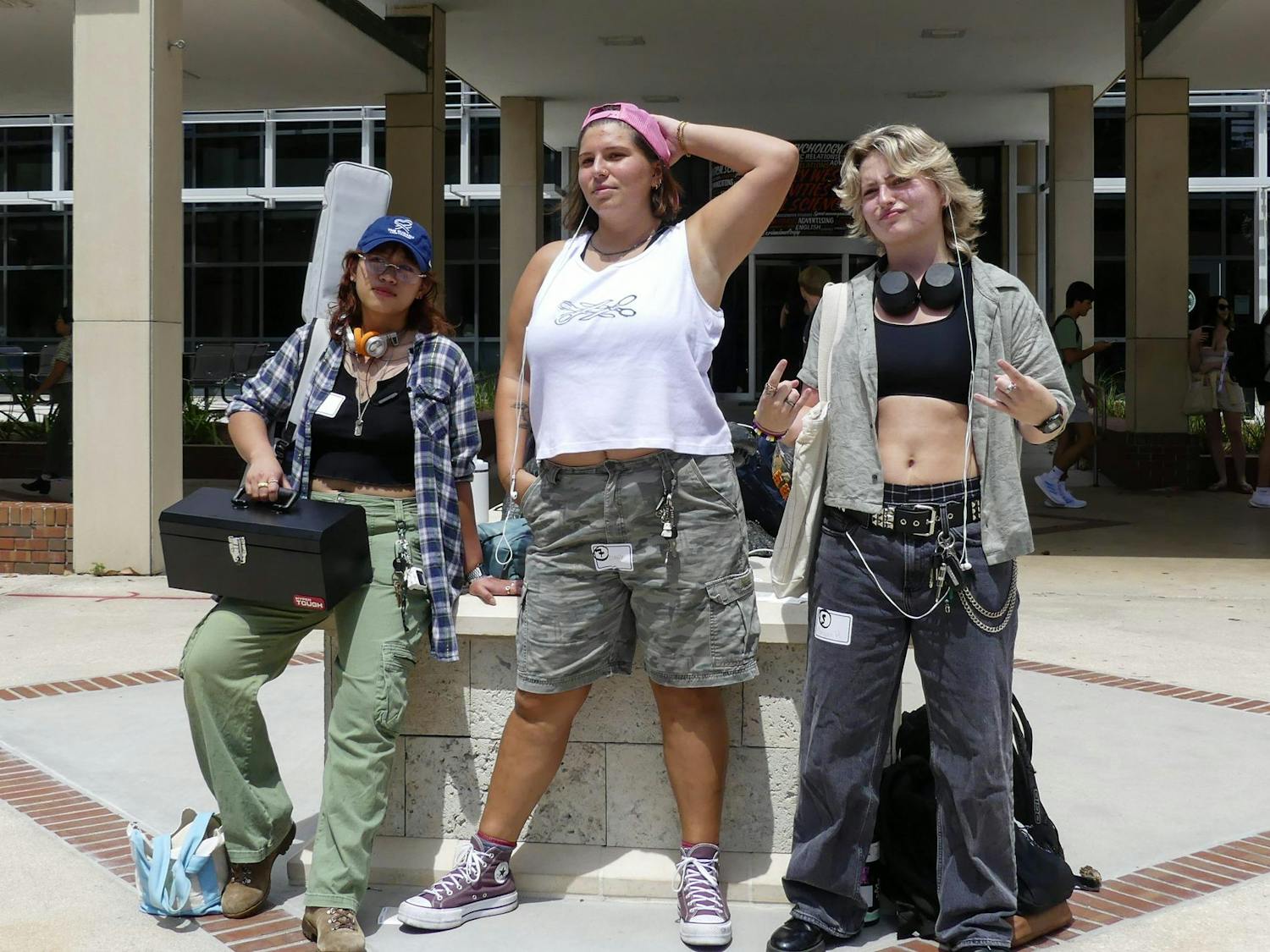 The three winners of the performative masculine lesbian contest, Ania, Claire and Morgan, pose for the crowd on Sept. 3, 2025.