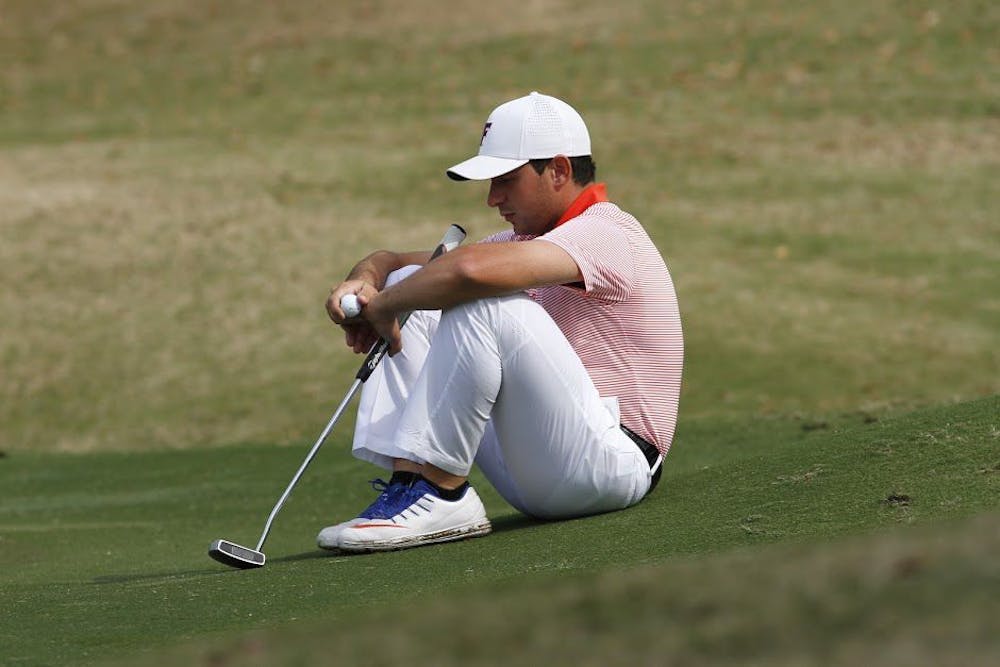 <p>UF's Alejandro Tosti stares at the ground during the SunTrust Gator Invitational on Feb. 18, 2017, at the Mark Bostic Golf Course.</p>