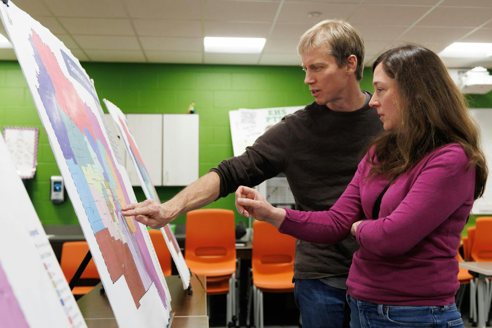 Raymond Rawls and Lorraine Duerden look at an elementary school rezoning map proposal at a community rezoning meeting held at Eastside High School in Gainesville, Fla., Wednesday, Feb. 11, 2026.