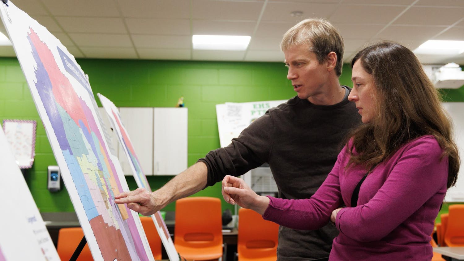 Raymond Rawls and Lorraine Duerden look at an elementary school rezoning map proposal at a community rezoning meeting held at Eastside High School in Gainesville, Fla., Wednesday, Feb. 11, 2026.