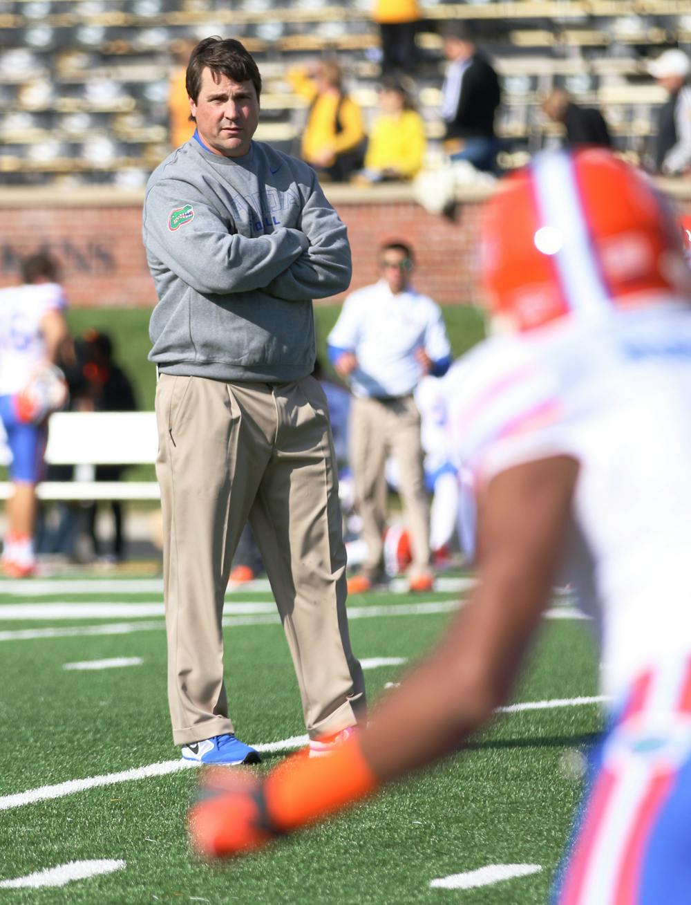 Coach Will Muschamp watches players warm up prior to Florida’s 36-17 loss to Missouri on Oct. 19 at Faurot Field in Columbia, Mo.