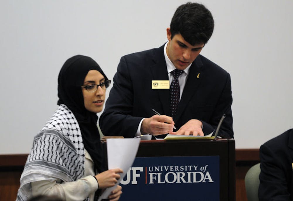 <p>Tesneem Shraiteh speaks at the Student Senate meeting Tuesday evening against the proposed Senate resolution condemning the Boycott, Divestment and Sanctions Movement.</p>