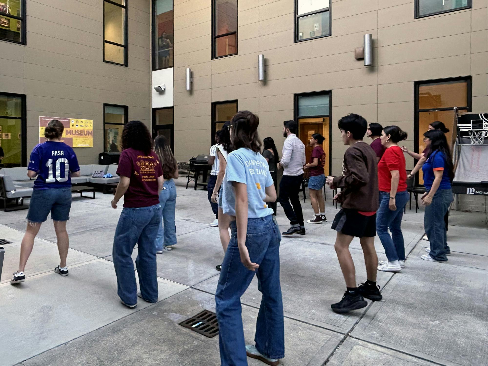 Students practice a bachata choreography at HSA’s museum night exhibit on Wednesday, April 16, 2025. 
