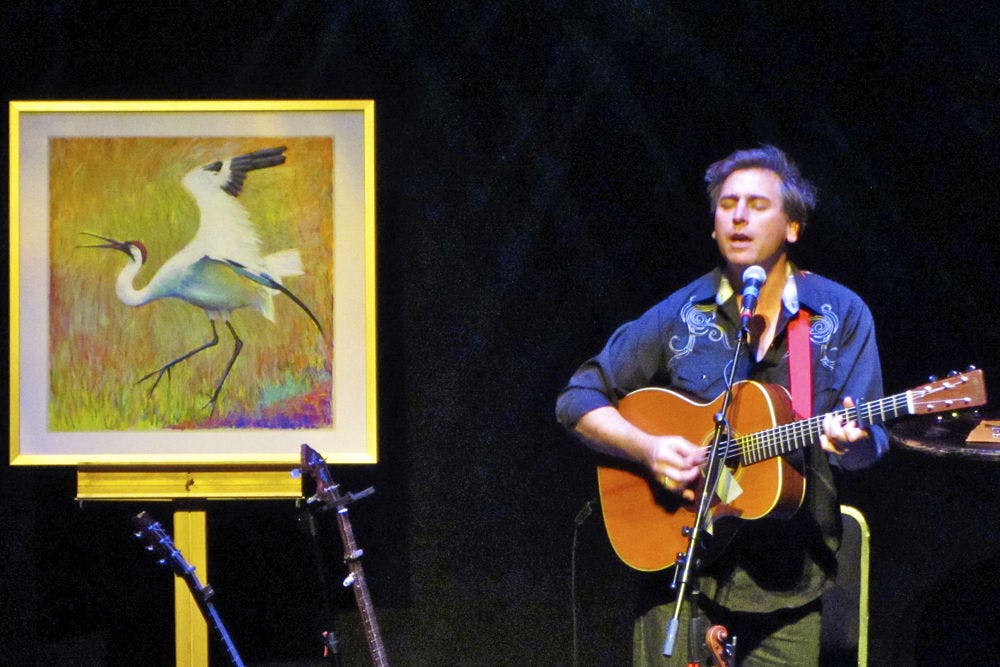 Joe Crookston, an American artist, writer and folk singer, performs at the Squitieri Studio Theatre in the west wing of the Phillips Center for the Performing Arts Thursday night."