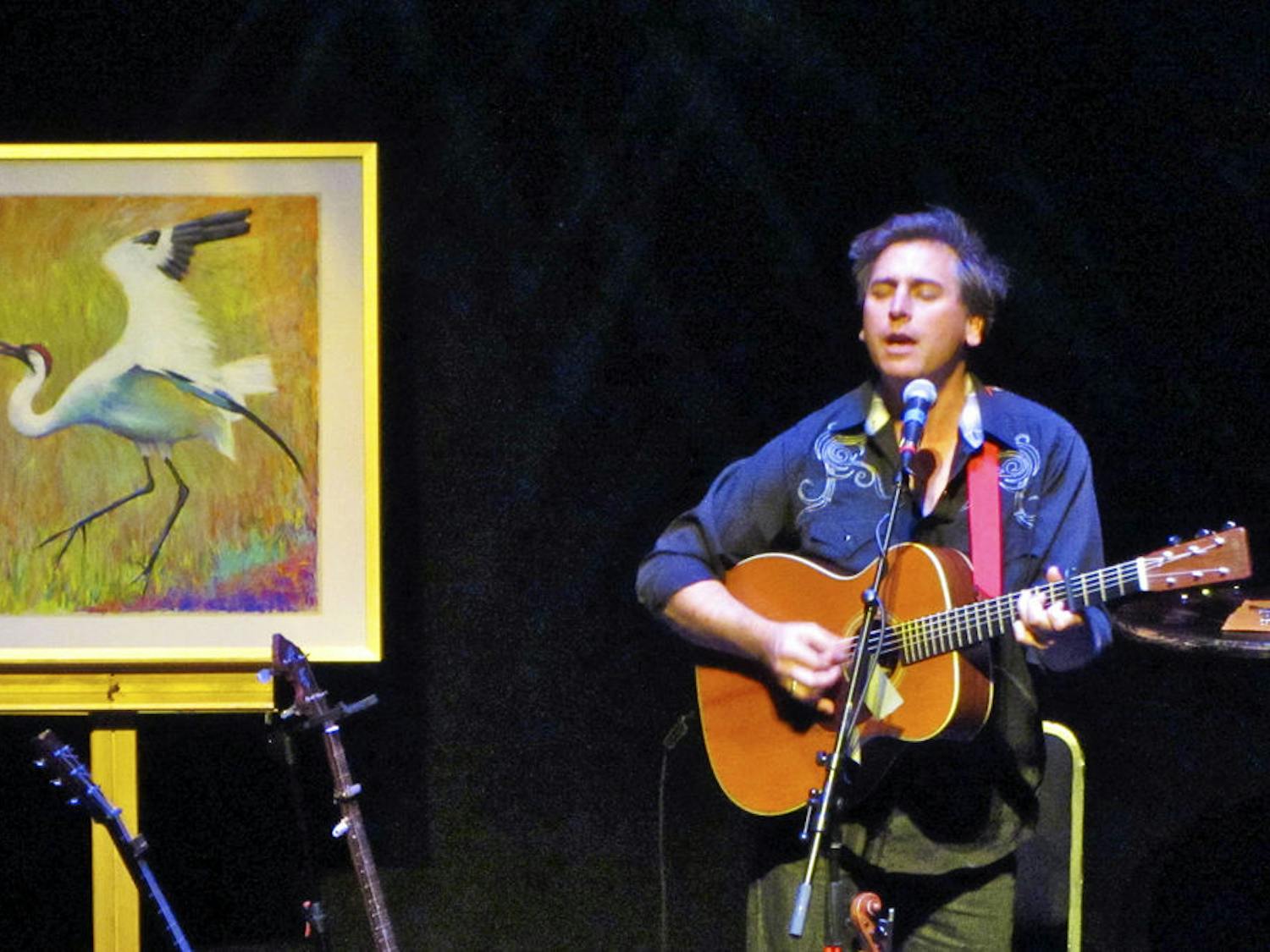 Joe Crookston, an American artist, writer and folk singer, performs at the Squitieri Studio Theatre in the west wing of the Phillips Center for the Performing Arts Thursday night."
